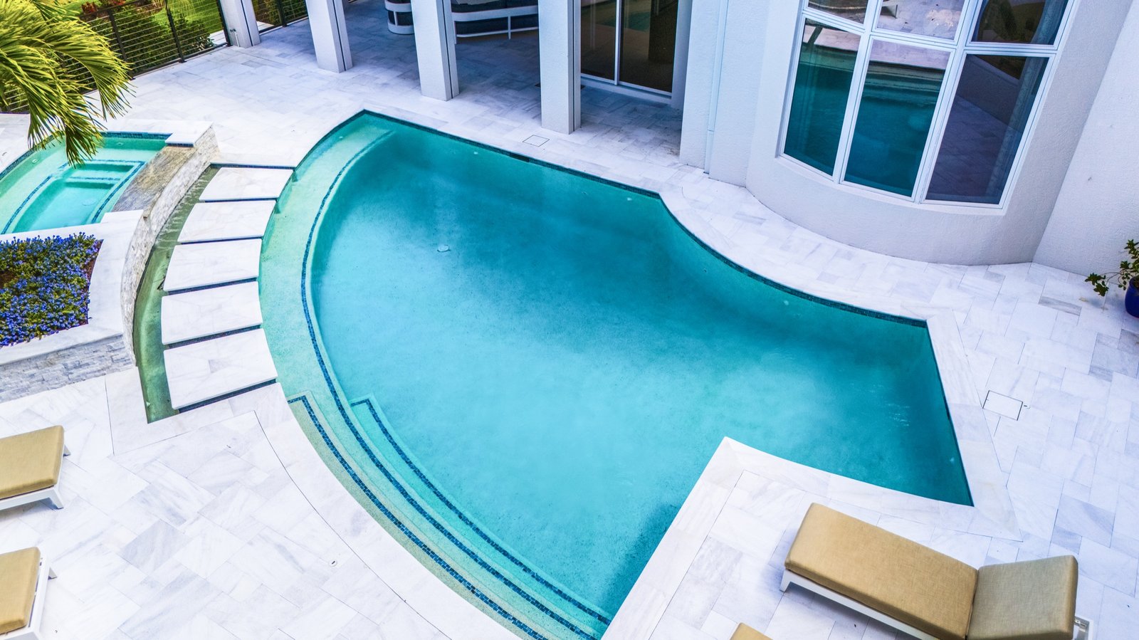 Drone perspective of a coastal Southwest Florida pool property