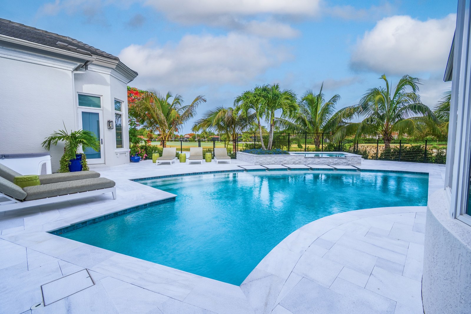 Outdoor lounge edge beside a luxury pool