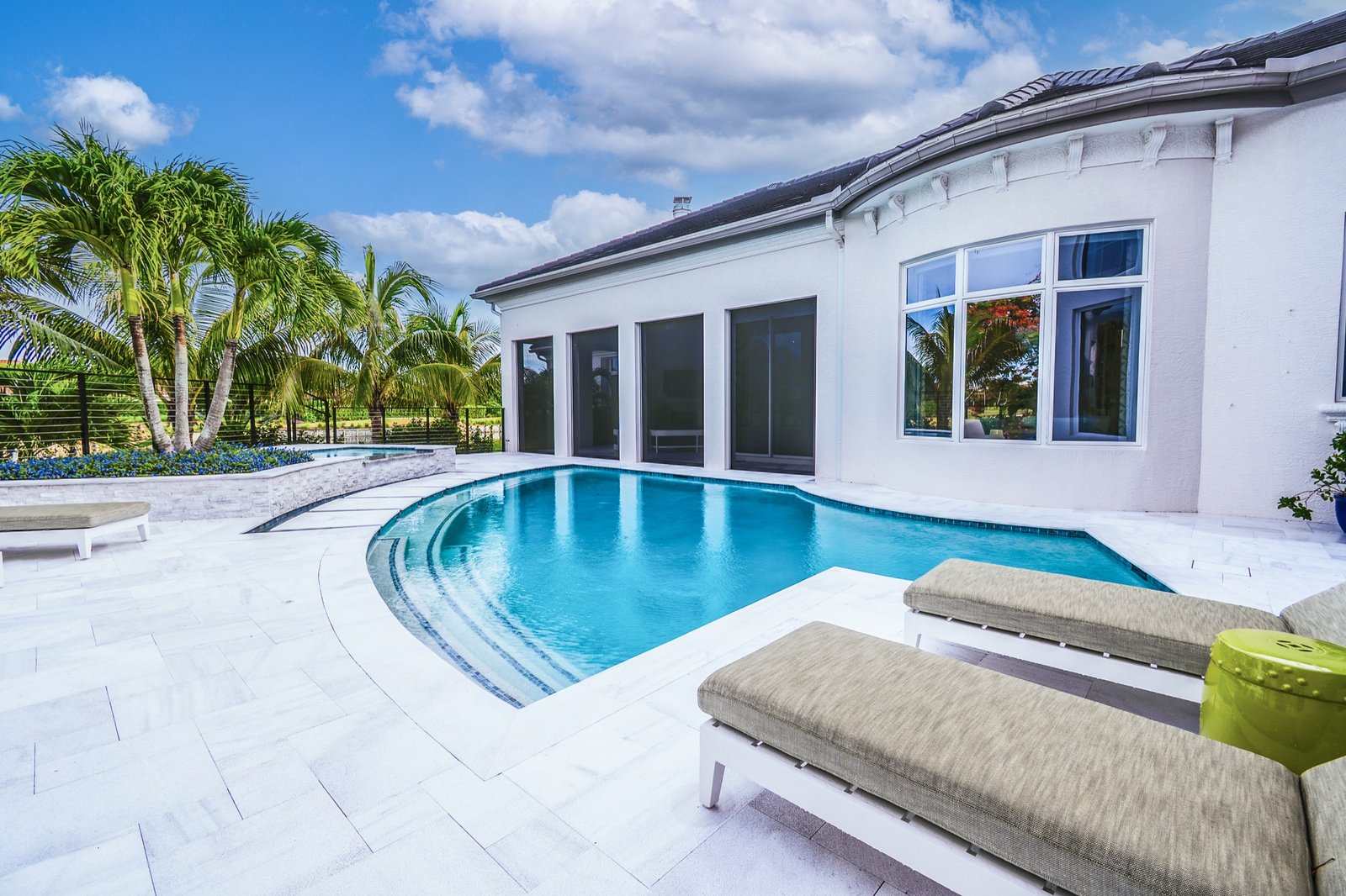 Bright poolside detail with premium deck and clear water